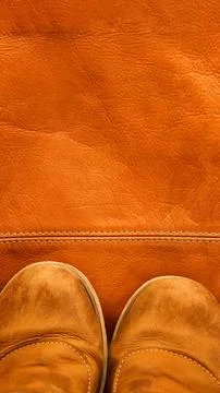 Brown leather shoes on the background of same bag, vertical, 16:9 Stock Photos