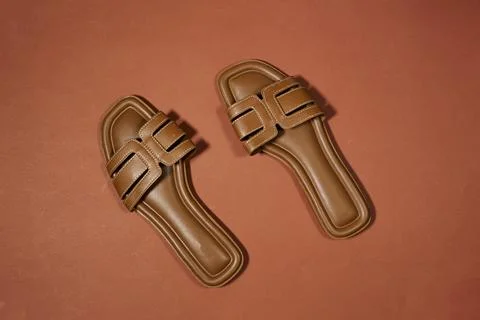 Brown Leather Slide Sandals Flat Lay on Terracotta Background, Minimal Summer Fo Stock Photos