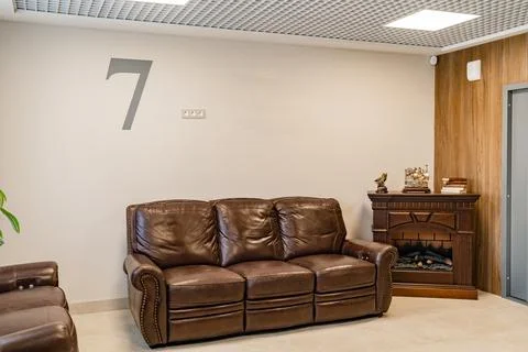 Brown leather sofas for home and office. upholstered furniture store. Stock Photos