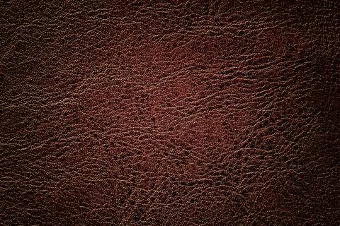 Brown leather texture background, closeup. Bronze cracked backdrop from skin Stock Photos