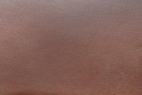 Brown leather texture background with fine grain pattern, natural material su Stockfoto's