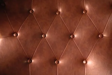Brown leather texture with buttons for pattern or background Stock Photos