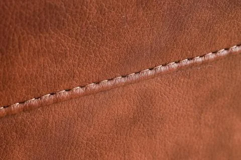 Brown leather texture with visible stitching, natural material background for 库存照片