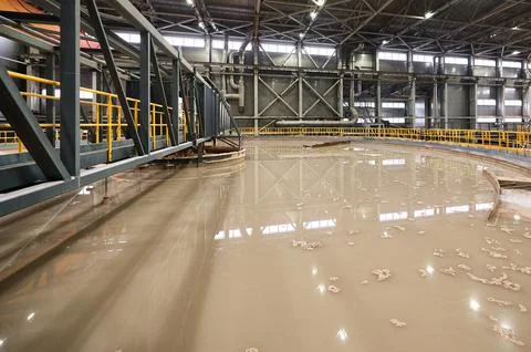 Brown liquid material in contemporary gravity thickener Stock Photos