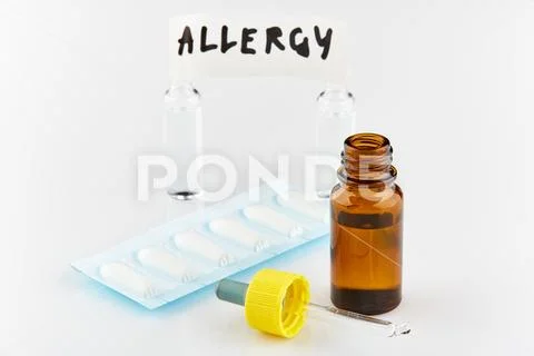 Brown medicine vial and pipette, packages with suppository and two ampoules Stock Photos