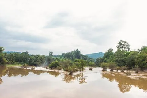 Brown mud river with rock called 'Khek river' in Pitsanulok's national park o Stock Photos
