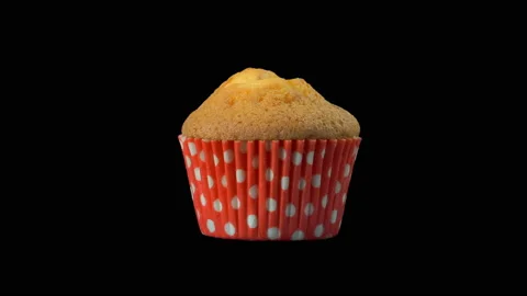 Brown muffin rotates on a black background. Isolated. Stock Footage 120123831