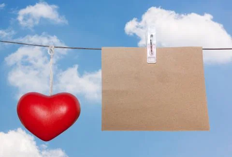 Brown note pad clothespin on wire cloth Stock Photos