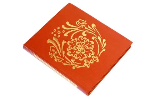 Brown notebook with a gold pattern on a white background 스톡 사진
