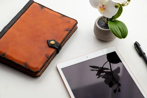 The brown notepad lies on the office table. Stock Photos
