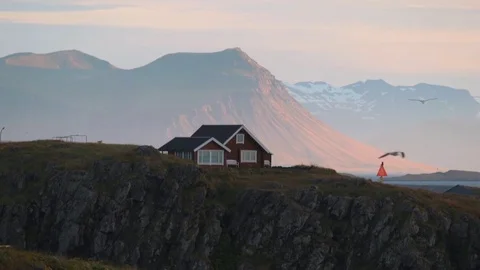 A brown one-storey house on the beach in Iceland. Andreev. Stock Footage 77976190
