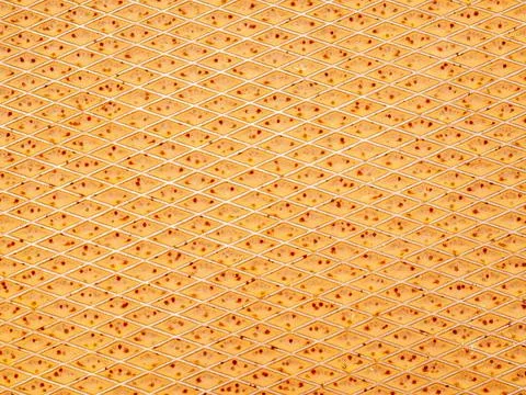 Brown orange surface divided into horizontal diamonds Stock Photos