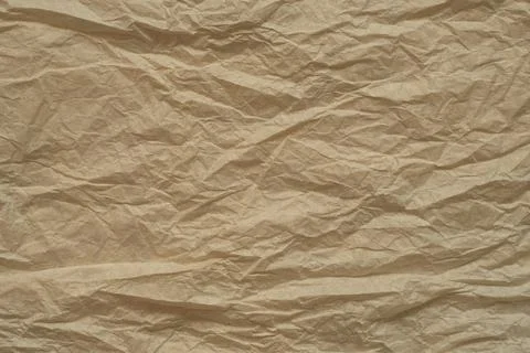 Brown paper background with rough texture and crumpled surface Stock Photos