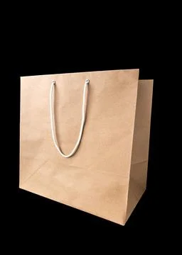Brown paper bag with empty blank space for design mockup isolated on black .. Stock Photos