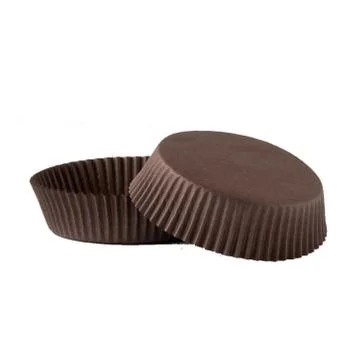 Brown paper baking forms for muffins Stock Photos