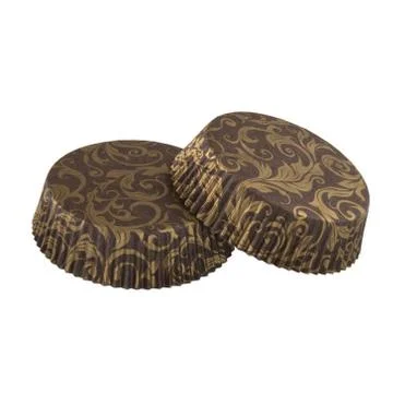Brown paper baking forms for muffins and cupcakes with golden pattern Stockfoto's