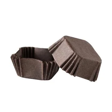 Brown paper baking forms for muffins and cupcakes Stock Photos