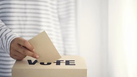 Brown paper insert in vote box, bright future of democracy concept Stock Footage 107518469