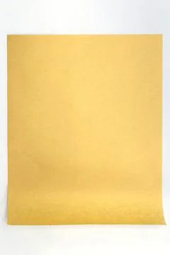 Brown paper with rolled end Stock Photos
