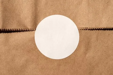 Brown paper texture with white circle sticker Stock Photos
