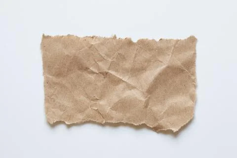 Brown paper torn at the edges in the shape of a rectangle on a white backgr.. Stock Photos