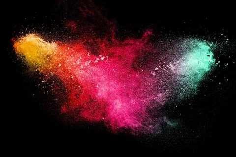 Brown particles exploding on black background, brown dust splashing Stock Photos