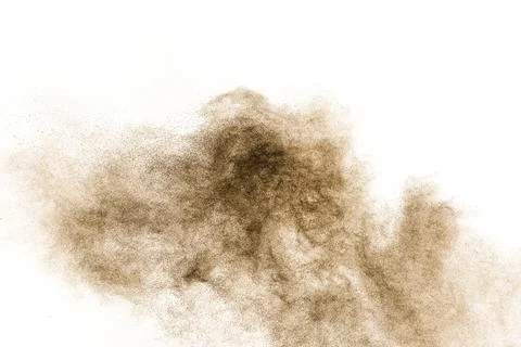 Brown particles splash on white background. Brown dust splatter. Stock Photos