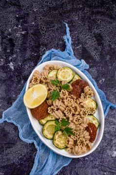 Brown pasta with vegetables Stock Photos