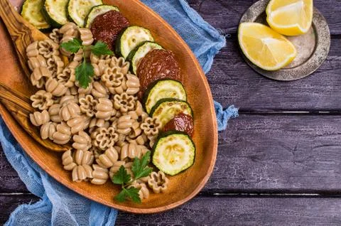 Brown pasta with vegetables Stock Photos