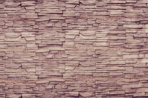 Brown pattern of decorative brown grey slate stone wall surface Stock Photos
