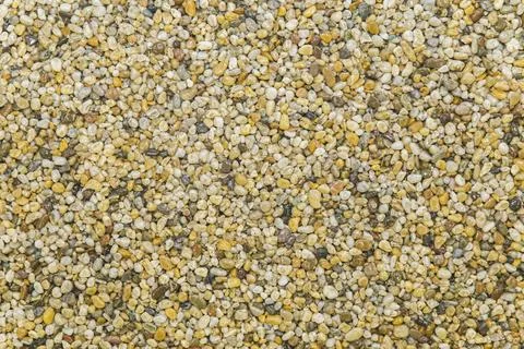 Brown pavement lined with tiny round pebbles Stock Photos