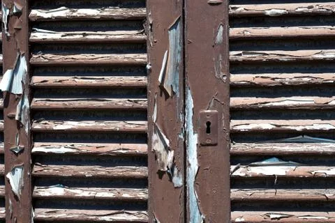 Brown peeling shutters Stock Photos