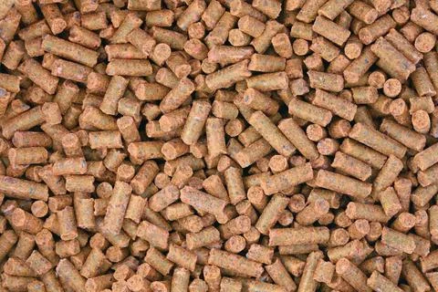 Brown pellets as organic background background Фото