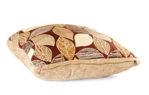 Brown pillow with leaves pattern Stock Photos