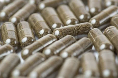 Brown pills or tablets. Close-up photography of tablets or pills. Stock Photos
