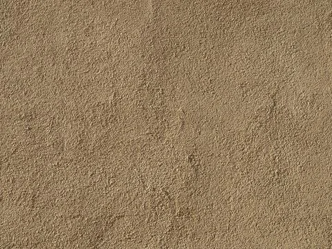 Brown plaster wall background Stock Photos