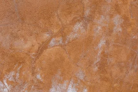 Brown plaster wall texture with white salt stains Photos