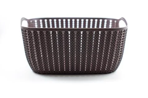 Brown plastic basket with woven pattern on a white Foto stock