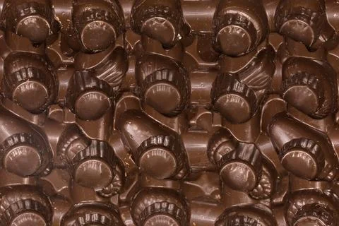 Brown plastic package for candy or similar confectionery products, fragment Stock Photos