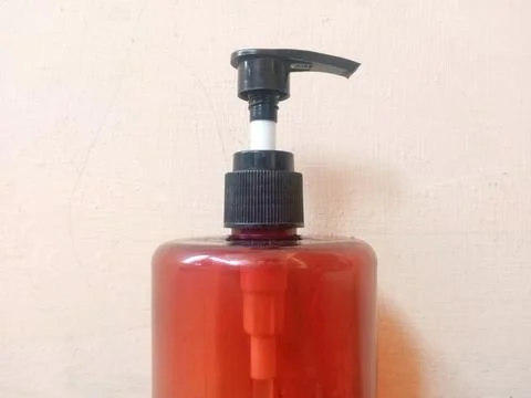 Brown Plastic Pump Bottle with Neutral Background Stock Photos