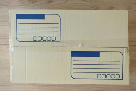 Brown post box packaging put on wood floor Foto stock