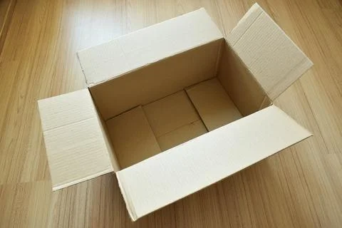 Brown post box packaging put on wood floor 스톡 사진
