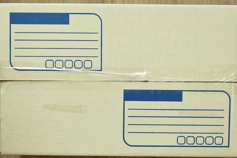 Brown post box packaging put on wood floor Stock Photos