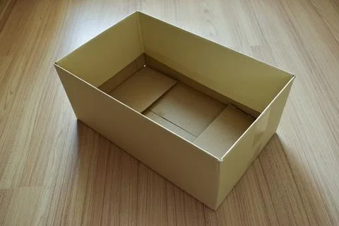 Brown post box packaging put on wood floor Foto stock