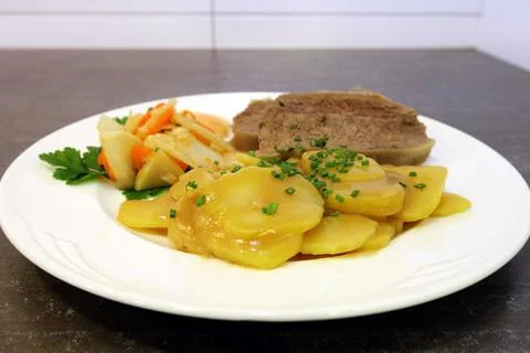 Brown potatoes and beef Stock Photos