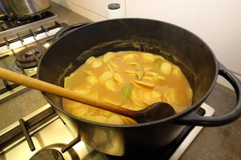 Brown potatoes in the pot Stock Photos