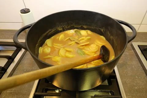 Brown potatoes in the pot Stock Photos