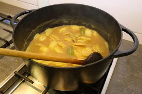 Brown potatoes in the pot Stock Photos