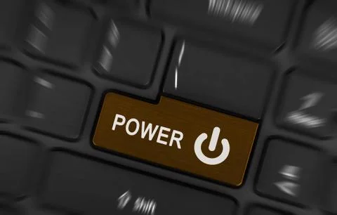 Brown power button on a black laptop keyboard Stock Photos