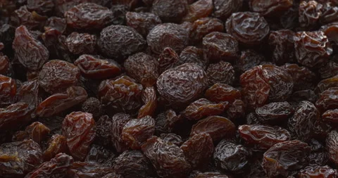 Brown raisins background texture. Stock Footage 308747196